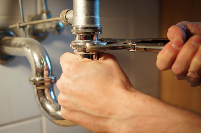 Plumber repairing a pipe